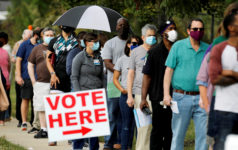 Image of people lined up to vote.