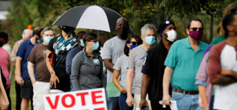 Image of people lined up to vote.