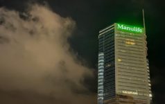 Manulife’s asset management unit takes 75% stake in Comvest Manulife building at night