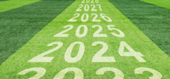 Years progressing from 2023 and on, painted on grass.