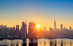 Golden sunrise over New York City's skyline.