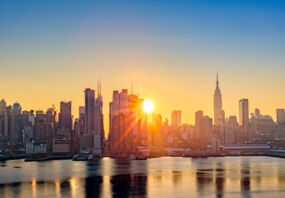 Golden sunrise over New York City's skyline.