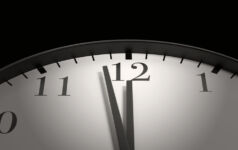 Nuveen Real Estate: Now is the time for commercial real estate debt clock with hands nearing 12