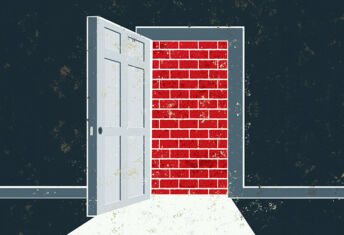An open door is blocked by a brick wall