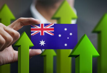 Nation Growth Concept, Green Up Arrows - Businessman Holding Card of Australia Flag