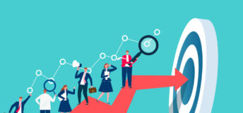 Businesspeople working on top of a red arrow as it approaches its goal