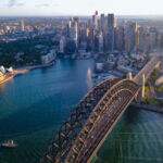 Aerial drone view of Sydney City and Sydney Harbour showing Sydney Harbour Bridge, NSW Australia in the late afternoon