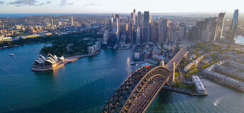Aerial drone view of Sydney City and Sydney Harbour showing Sydney Harbour Bridge, NSW Australia in the late afternoon