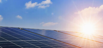 Solar panels with sunset and blue sky background. Clean power energy concept