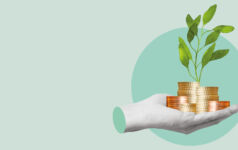 A severed hand holds several stacks of coins from which a green shoot sprouts