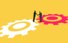Illustration of two business people shaking hands while standing on different cogs.
