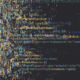 A human face made up of computer code