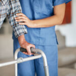 Woes continue at FS KKR: Enhancement actions announced Shot of a woman assisting her elderly patient who's using a walker for support