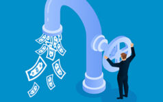 Businessman opens faucet valve to control money outflow