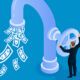 Businessman opens faucet valve to control money outflow