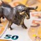 Bull ornament on top of 50 euro notes