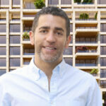 Exclusive: Slate closes $1bn SMA to expand senior lending platform Martin Nussbaum, co-founder and principal at Slate Property Group, in front of a rendering of 264-272 West 135th Street in the Harlem neighborhood of Manhattan.