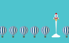 Several hot air balloons in a line with a cartoon rocket ship in between launching into space